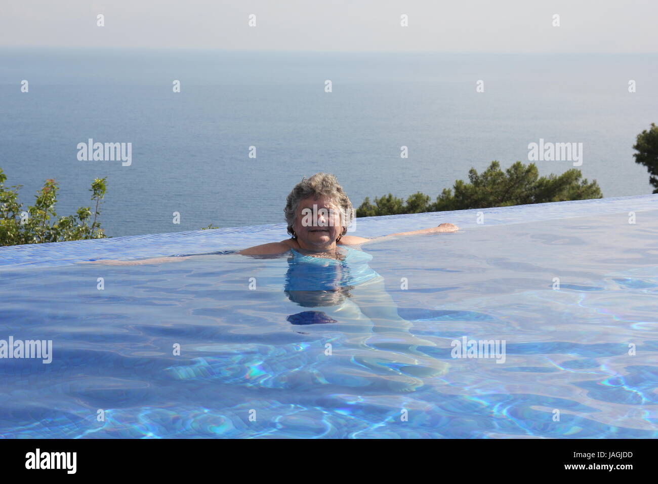 Older woman swimming hi-res stock photography and images - Alamy