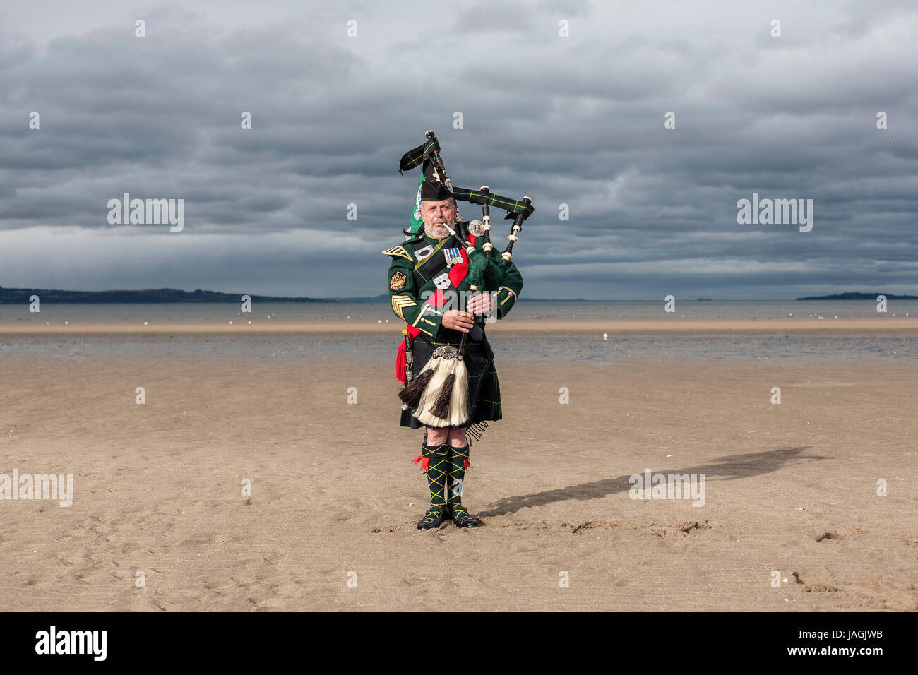 John Mackintosh is a traditional Scottish Bagpiper. He had a career as a Piper in the British Army, the Edinburgh City Police Pipe Band and the Lothia Stock Photo