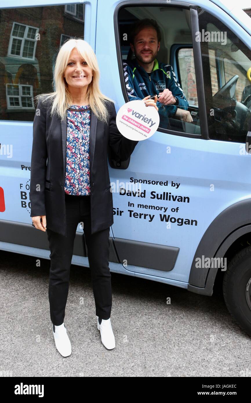 Celebrity Ambassador of Variety Gaby Roslin attends handover of keys and photocall of The Variety Sunshine Coach to Football Beyond Borders Charity. The mini bus has been generously donated by David Sullivan in memory of Terry Wogan.  Football Beyond Borders is an educational charity which uses football as an engagement tool to provide young people aged 9 – 14, who have been identified by their school as being at risk of exclusion, with the opportunity to achieve their goals and fulfil their potential. They do this through a football themed, literacy curriculum which puts a young person’s pass Stock Photo