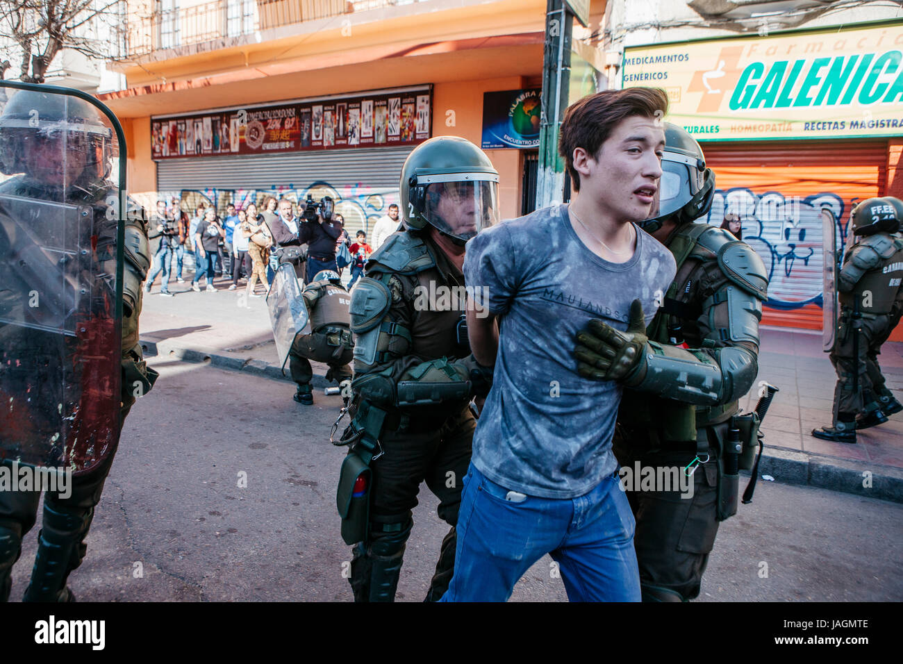 Valparaiso, Chile - June 01, 2017: Protester arrested by the chilean riot police during a protest in the center of Valparaiso, following President Mic Stock Photo