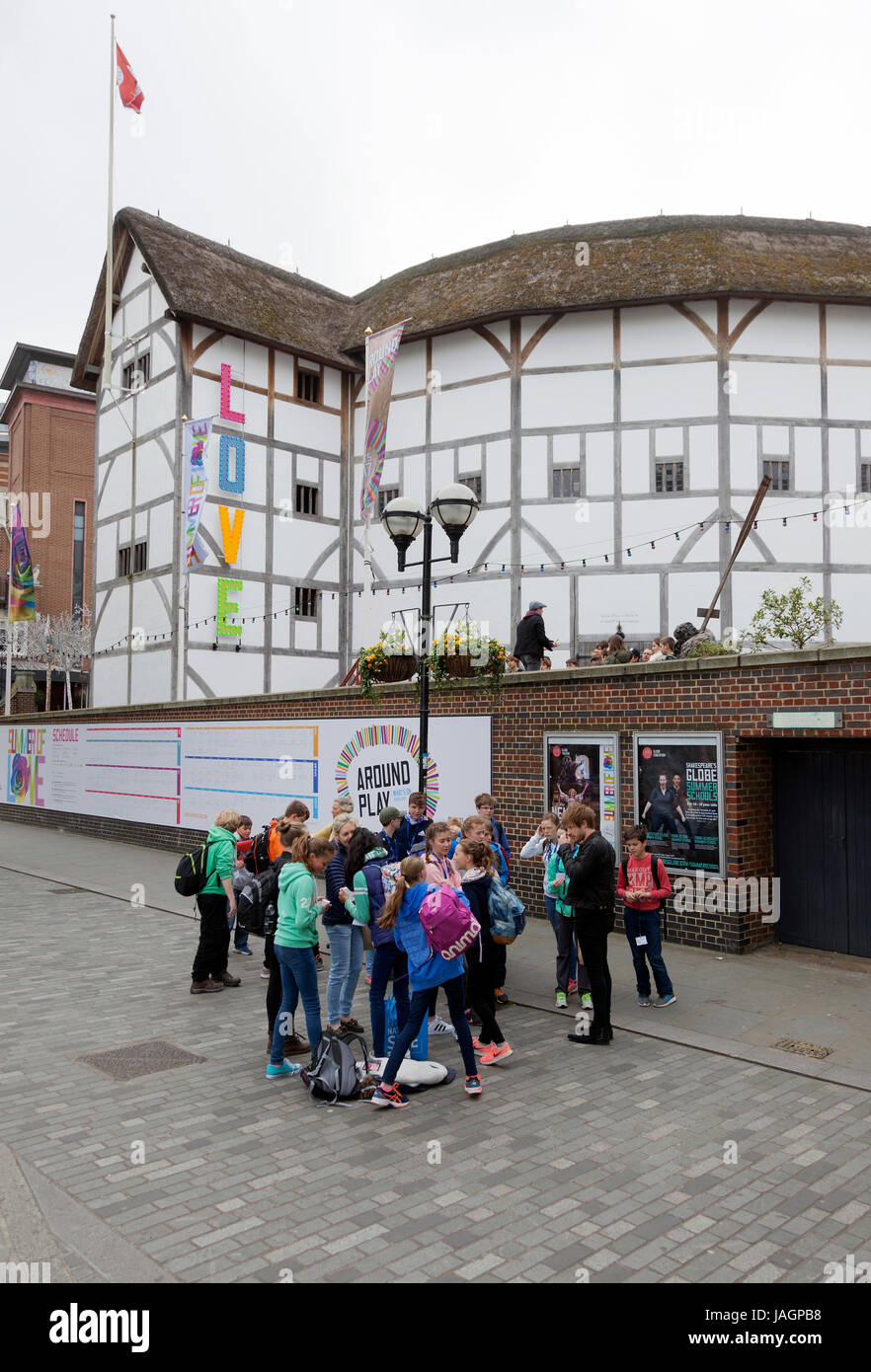 London, United Kingdom, 6 may 2017: group of teenagers stands in front of shakespeare's globe theatre on southbank of river thames in london Stock Photo