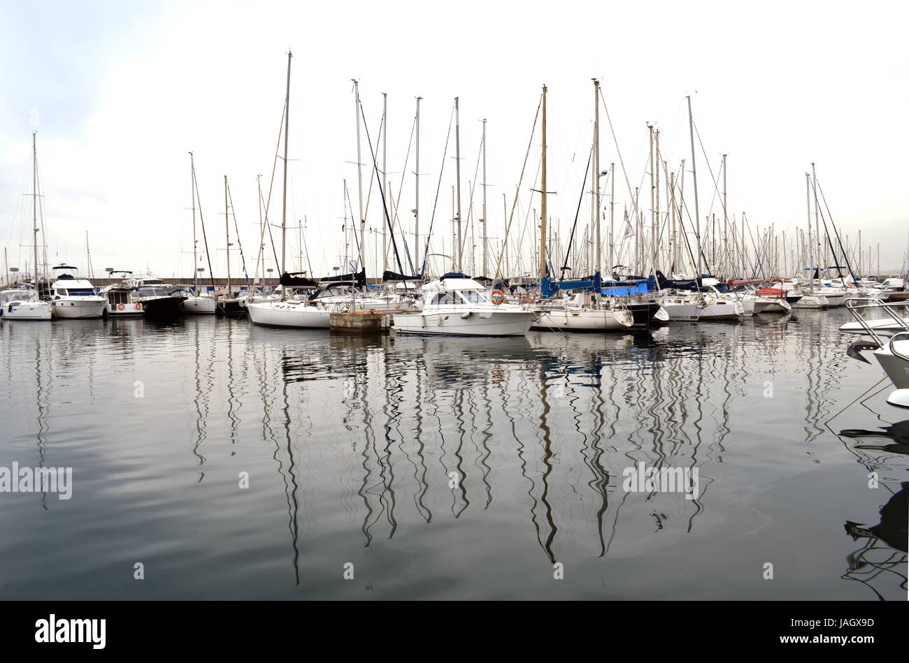 Boats moored in the harbor Stock Photo - Alamy