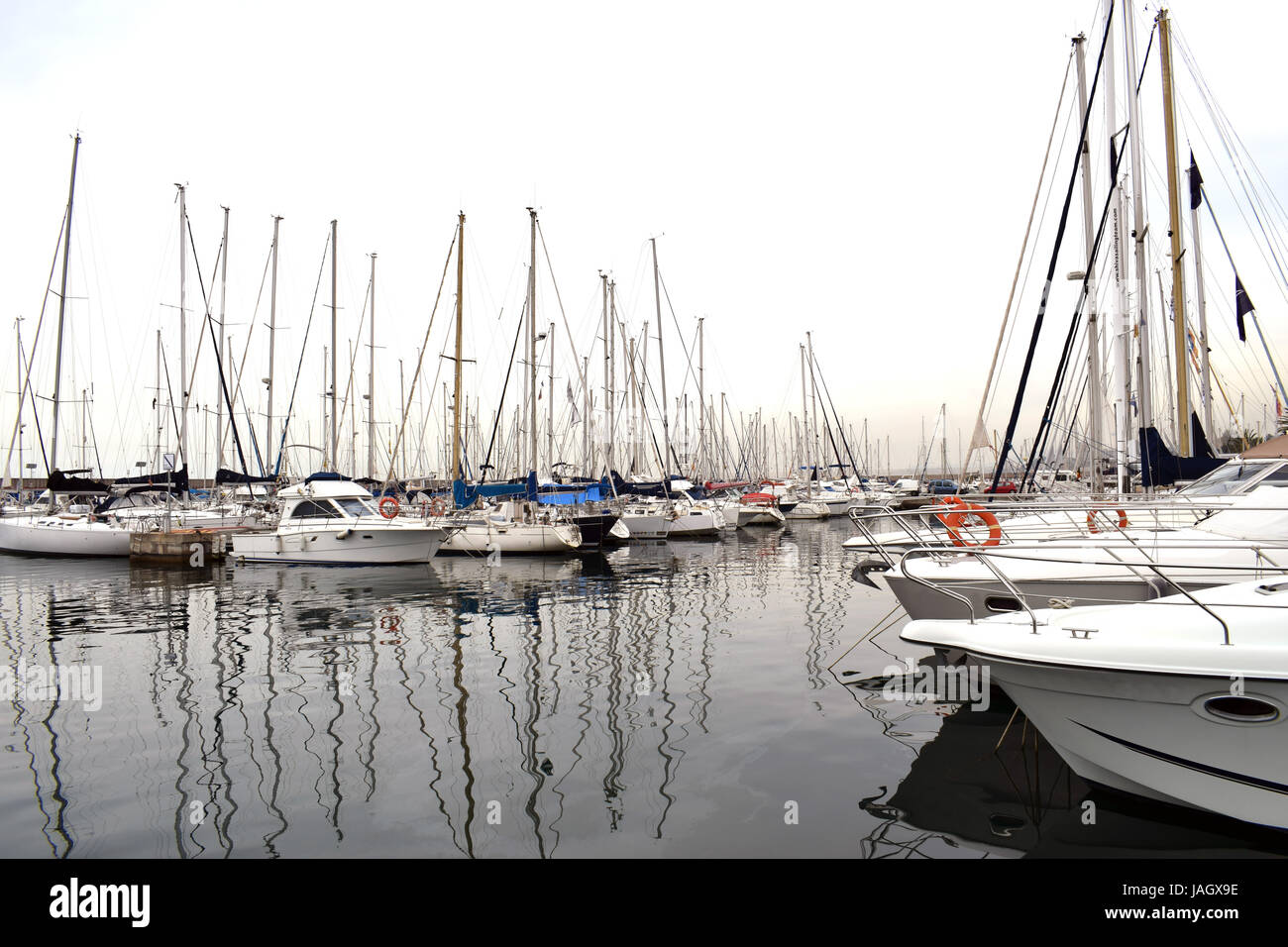 Boats moored in the harbor Stock Photo - Alamy