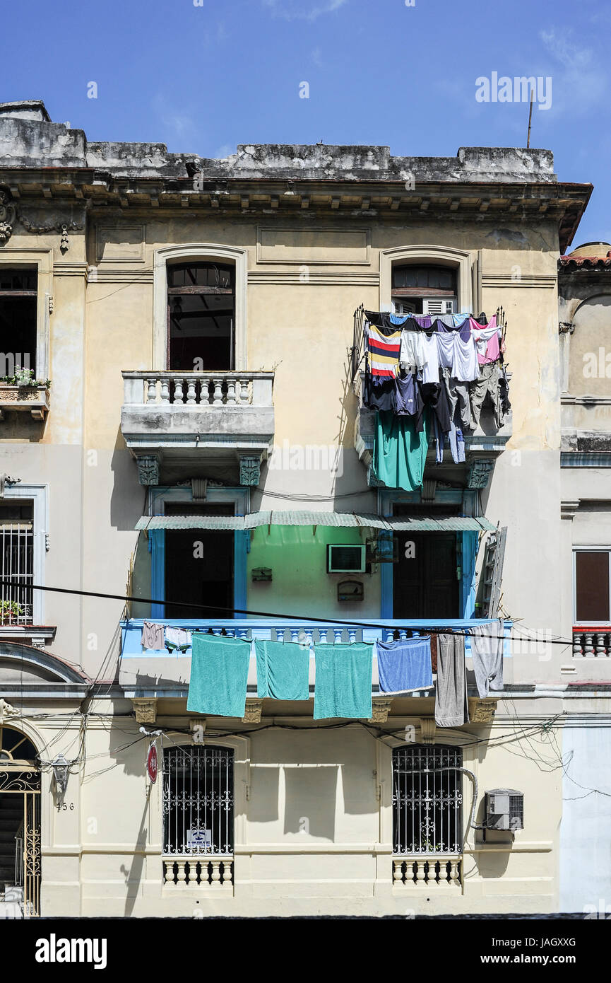 A woman hanging out her washing on a clothesline on her balcony, Brasil St,  Havana cuba Stock Photo - Alamy