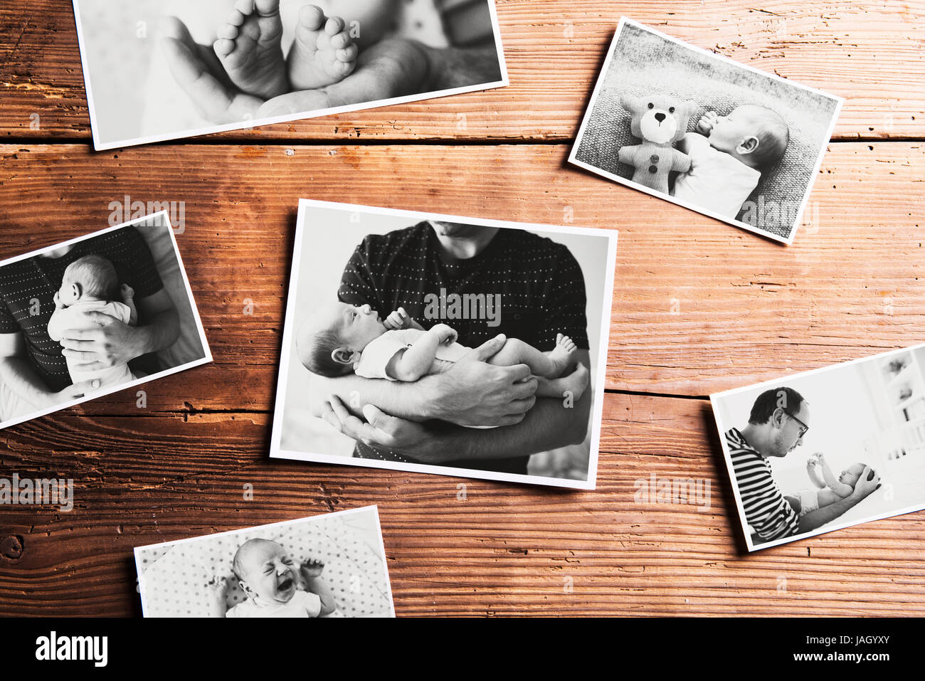 Pictures of father and baby, wooden background. Fathers day. Stock Photo