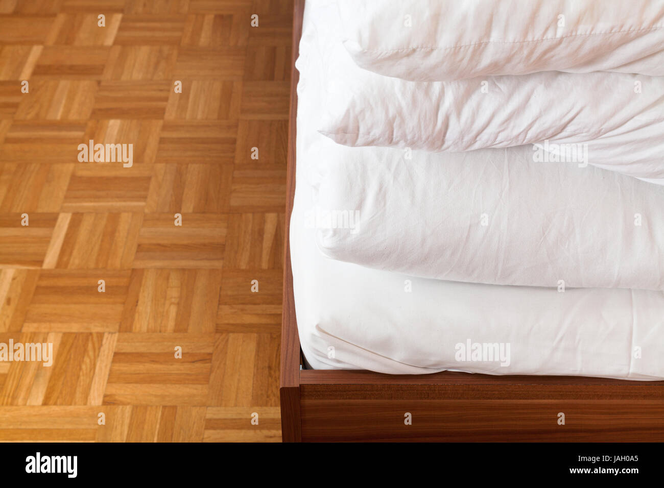 tucked blanket and bed sheet in double bed close up Stock Photo Alamy