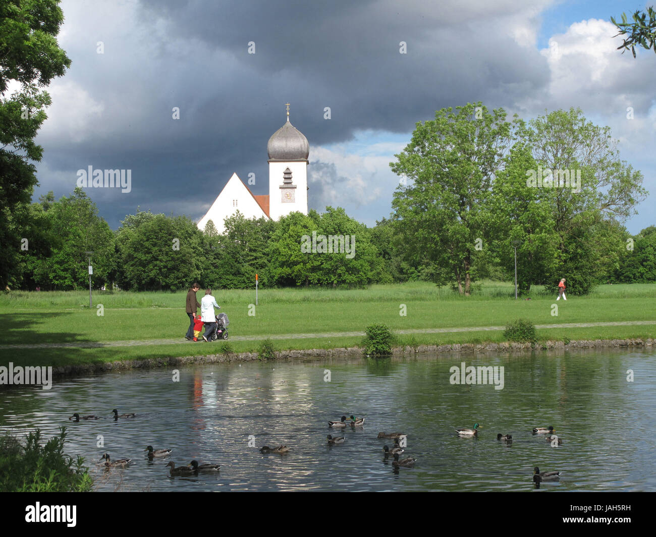 Germany,Bavaria,Munich,Obermenzing,park,pond,town parish church 'ailment of Christ', Stock Photo