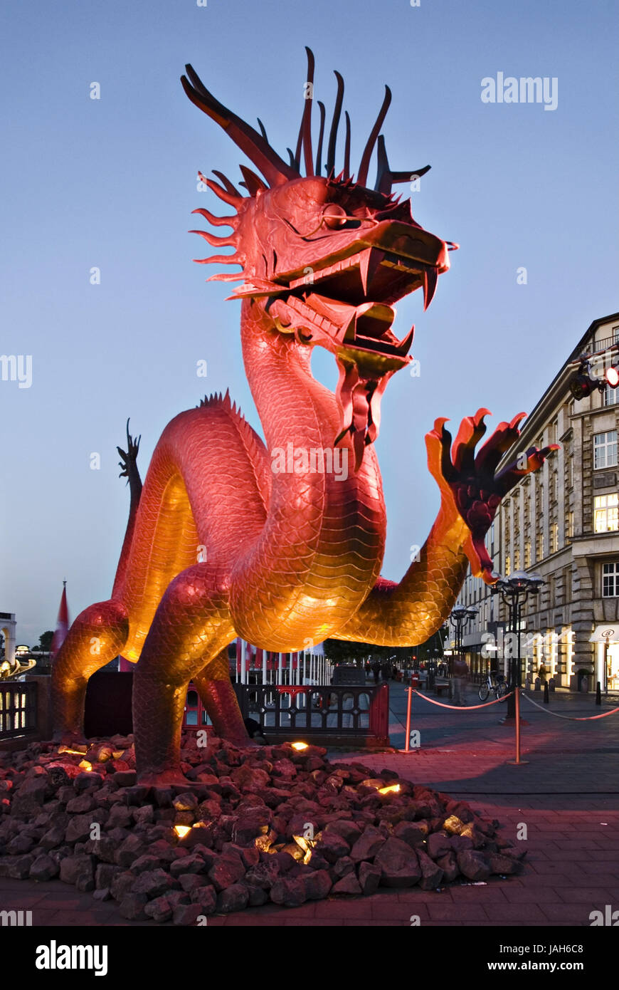 The brightly illuminated copper dragon at the city hall market to China
