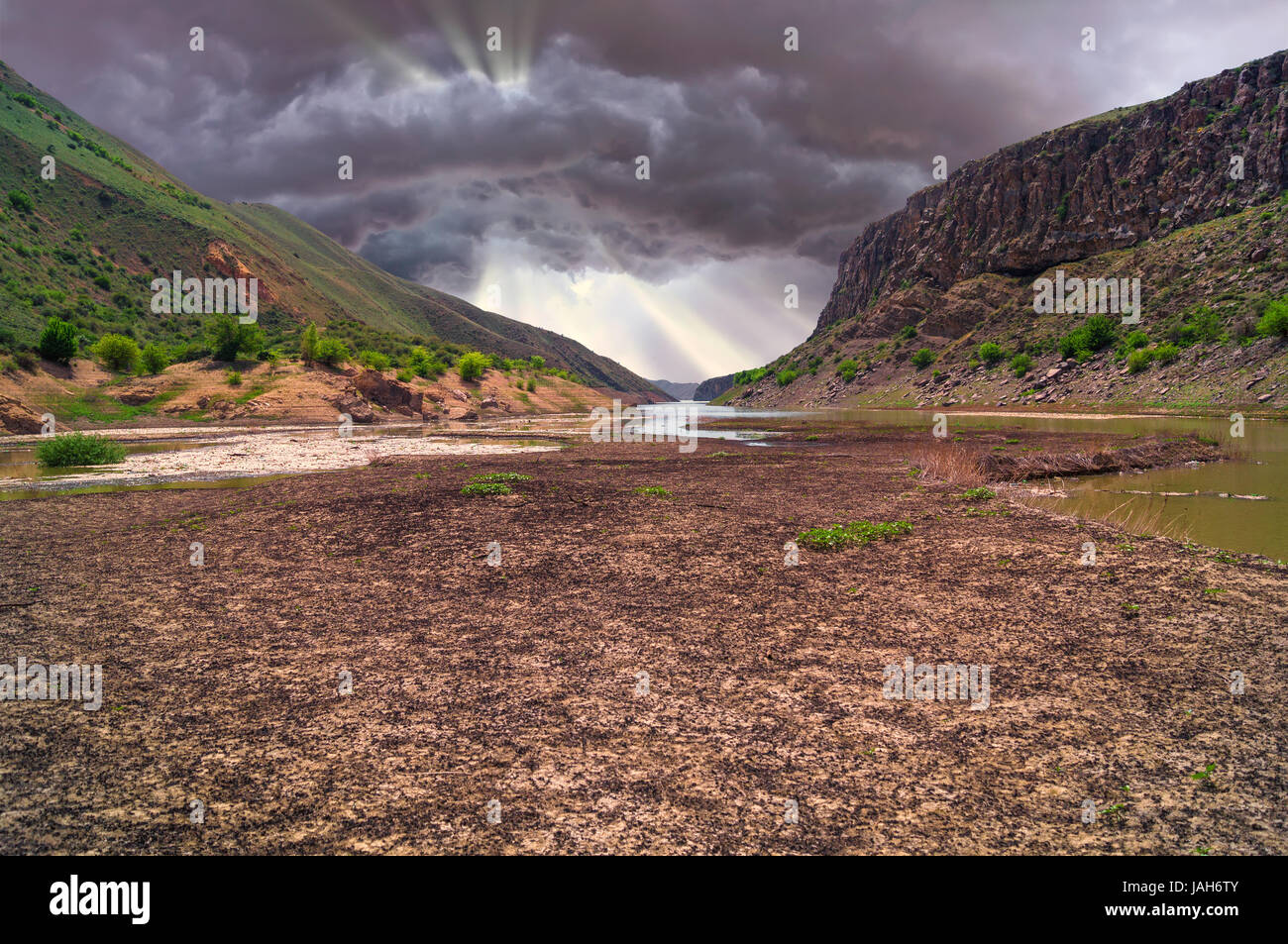 storm clouds sunset over dried lake Stock Photo - Alamy