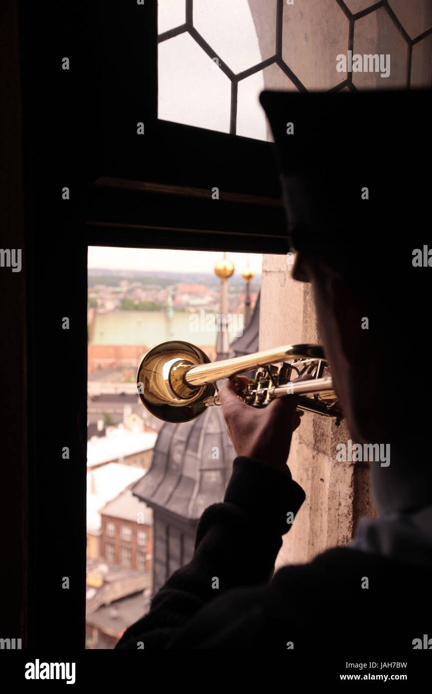 Poland,Cracow,small Pole,Rynek Glowny,square,Marien's church,Old Town,everyday life,tower,the blower,trumpet player,signal,watchman, Stock Photo