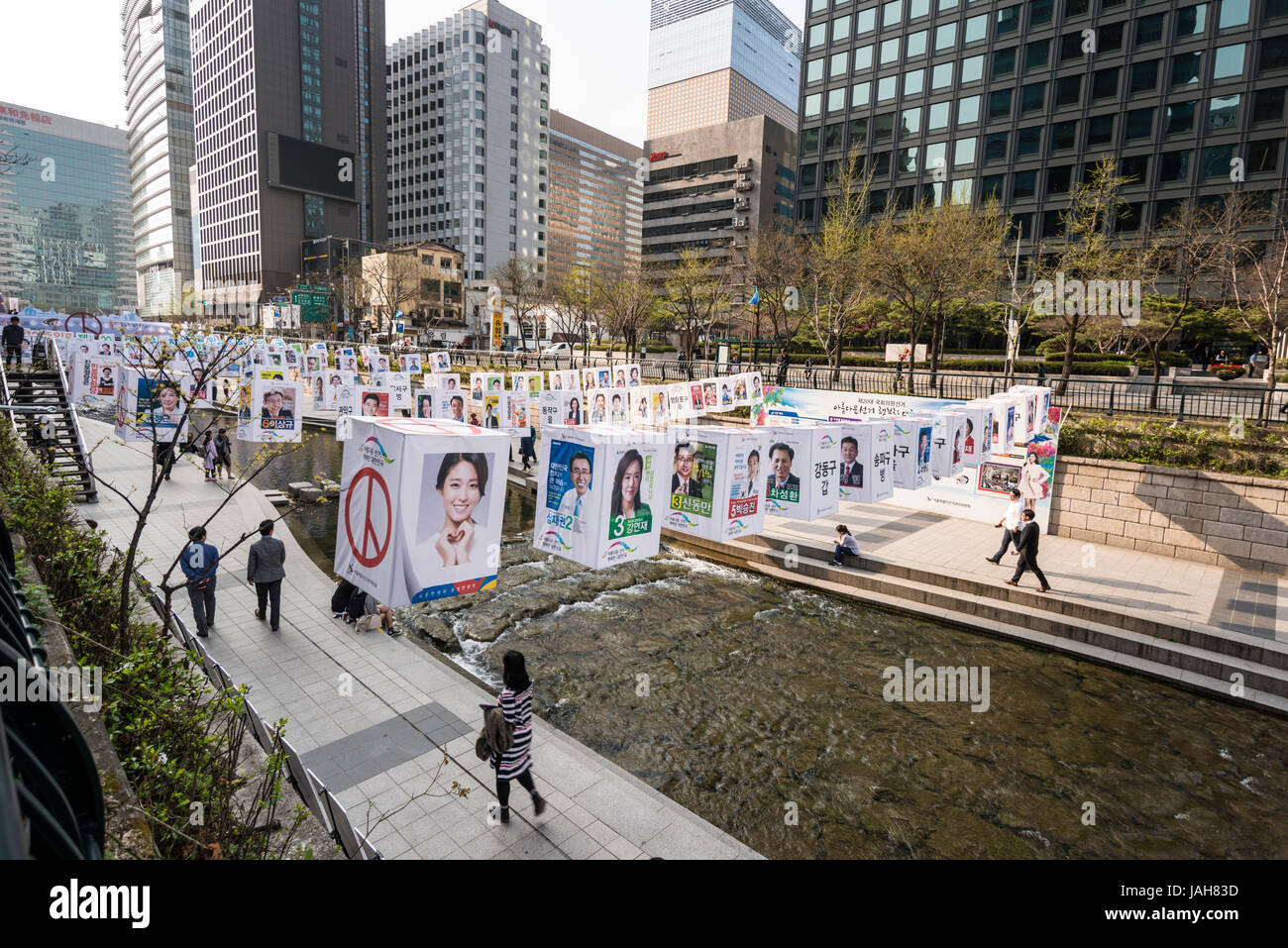 Photographs of candidates for Member of Parliament displayed over Cheonggyecheon stream, Seoul, South Korea Stock Photo