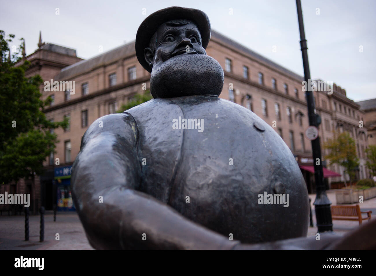 The statue of Desperate Dan in Dundee City Centre alongside a statue of Beano character, Minnie the Minx. Dundee, Scotland. Stock Photo