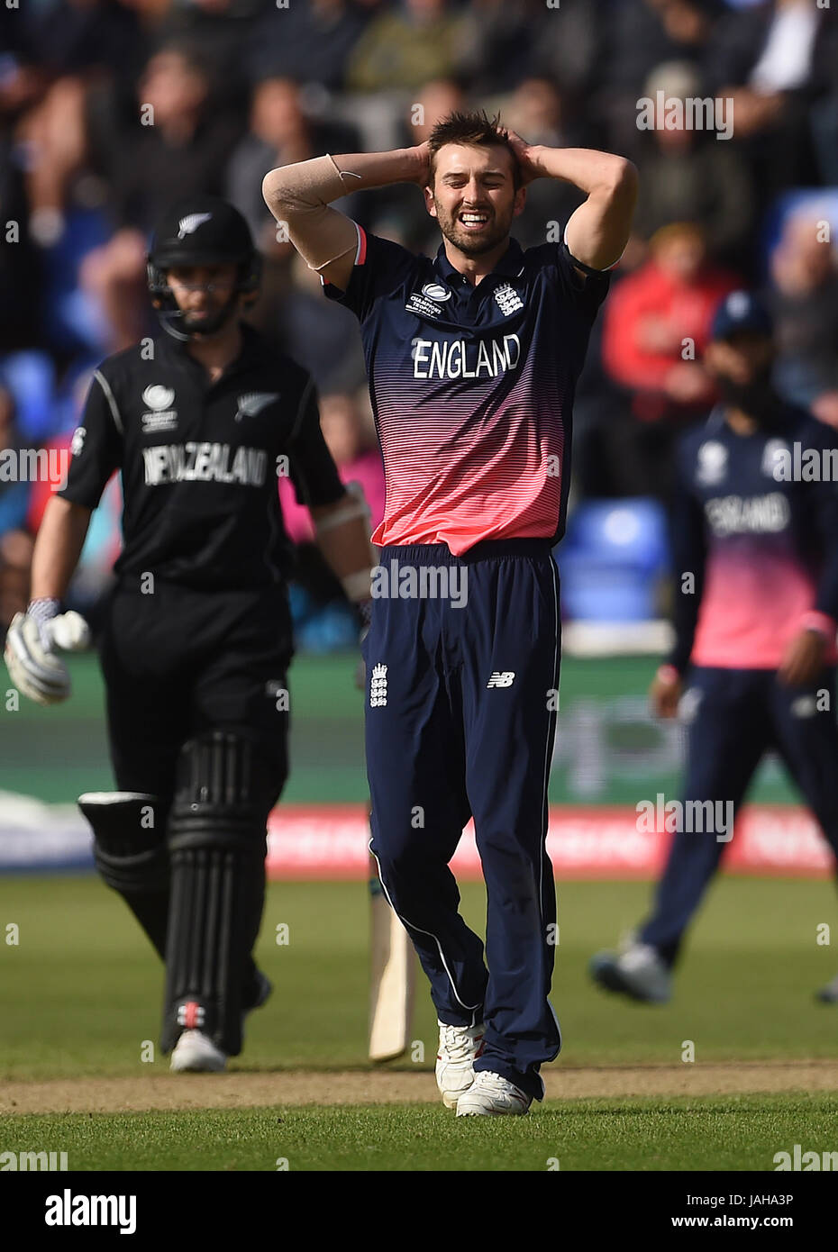 England's Mark Wood reacts after bowling during the ICC Champions