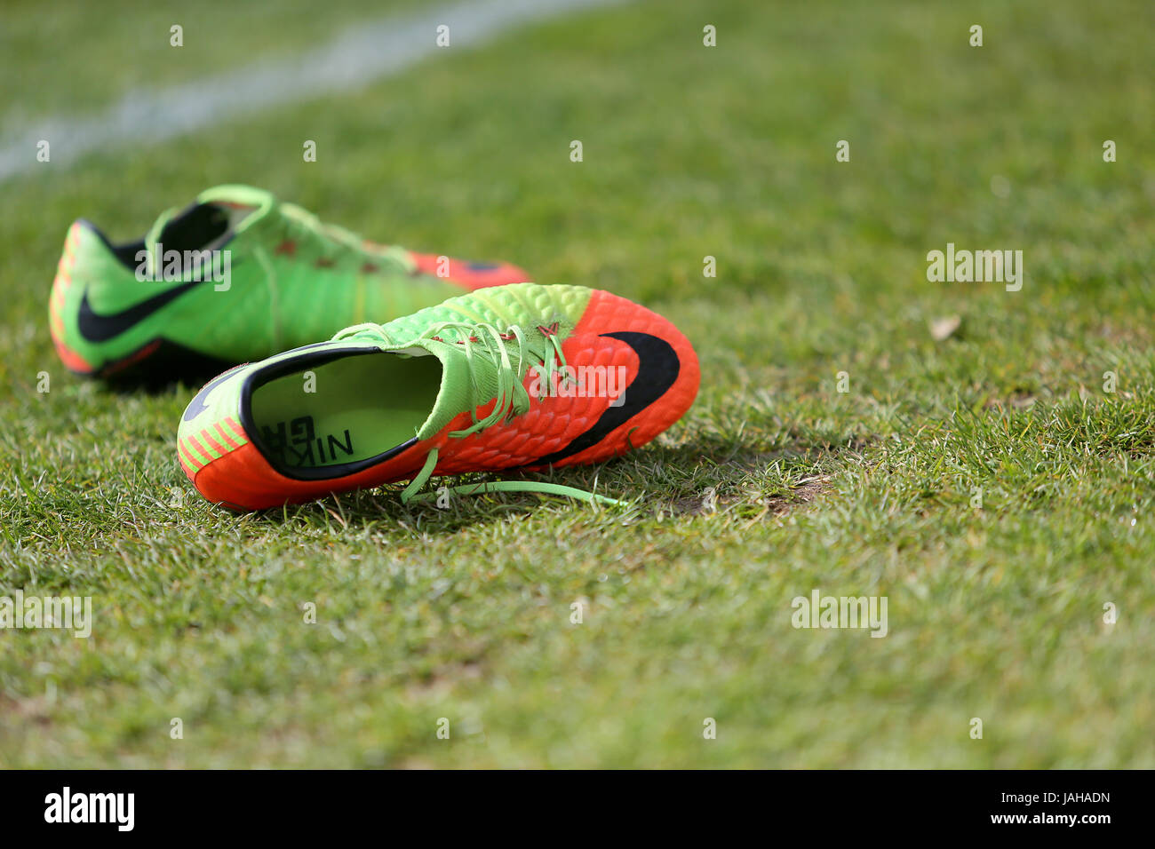A pair of Nike football boots on the pitch Stock Photo Alamy
