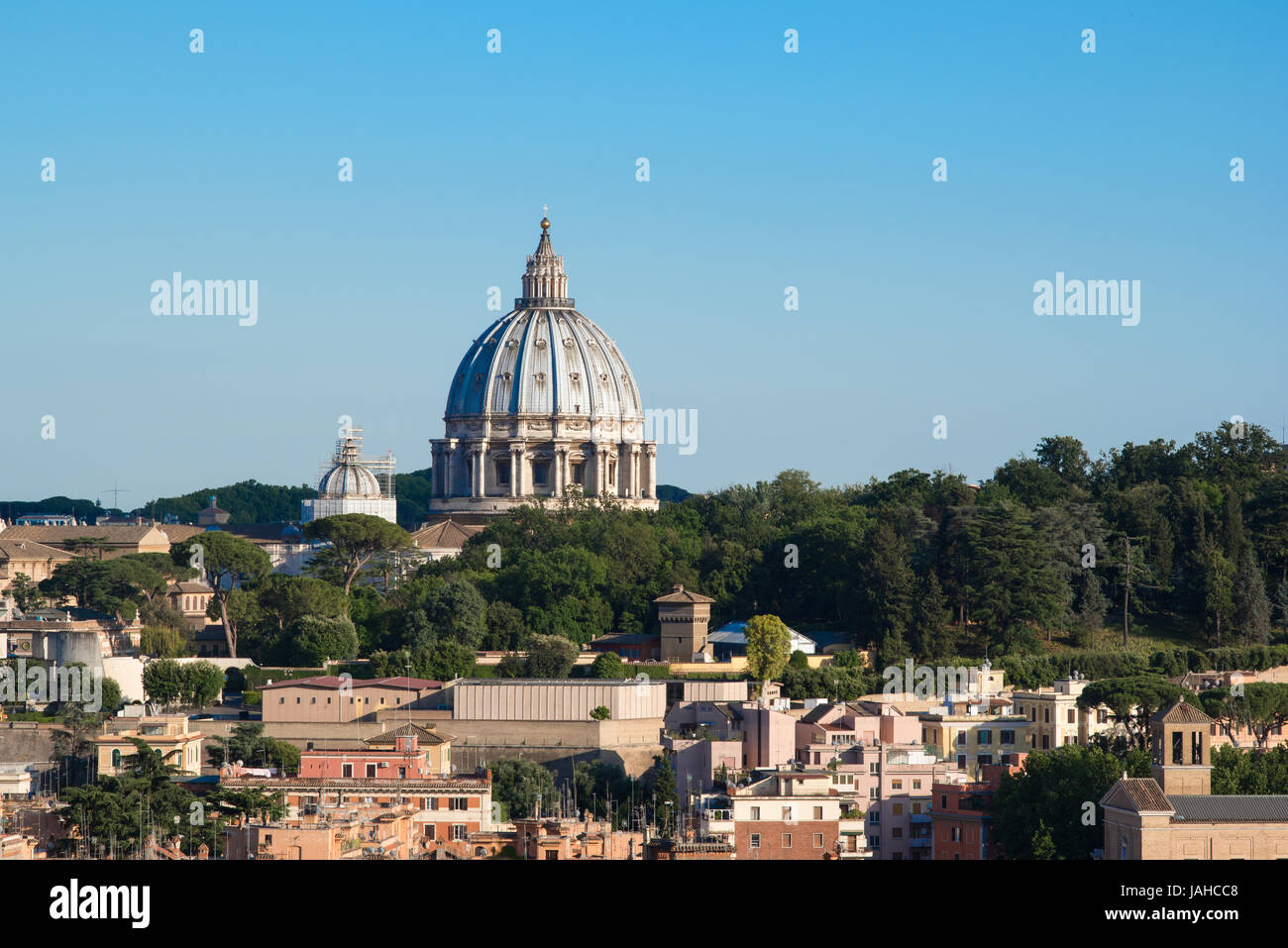 Rome cityscape with St Peter dome, sunset colors and buildings Stock Photo