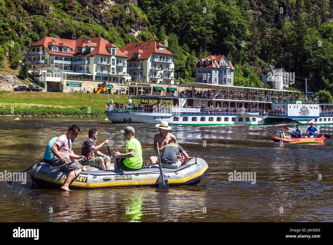 Rafting boat and paddle steamer on Elbe river, Kurort Rathen, Saxon Switzerland, Saxony, Germany, Europe Stock Photo
