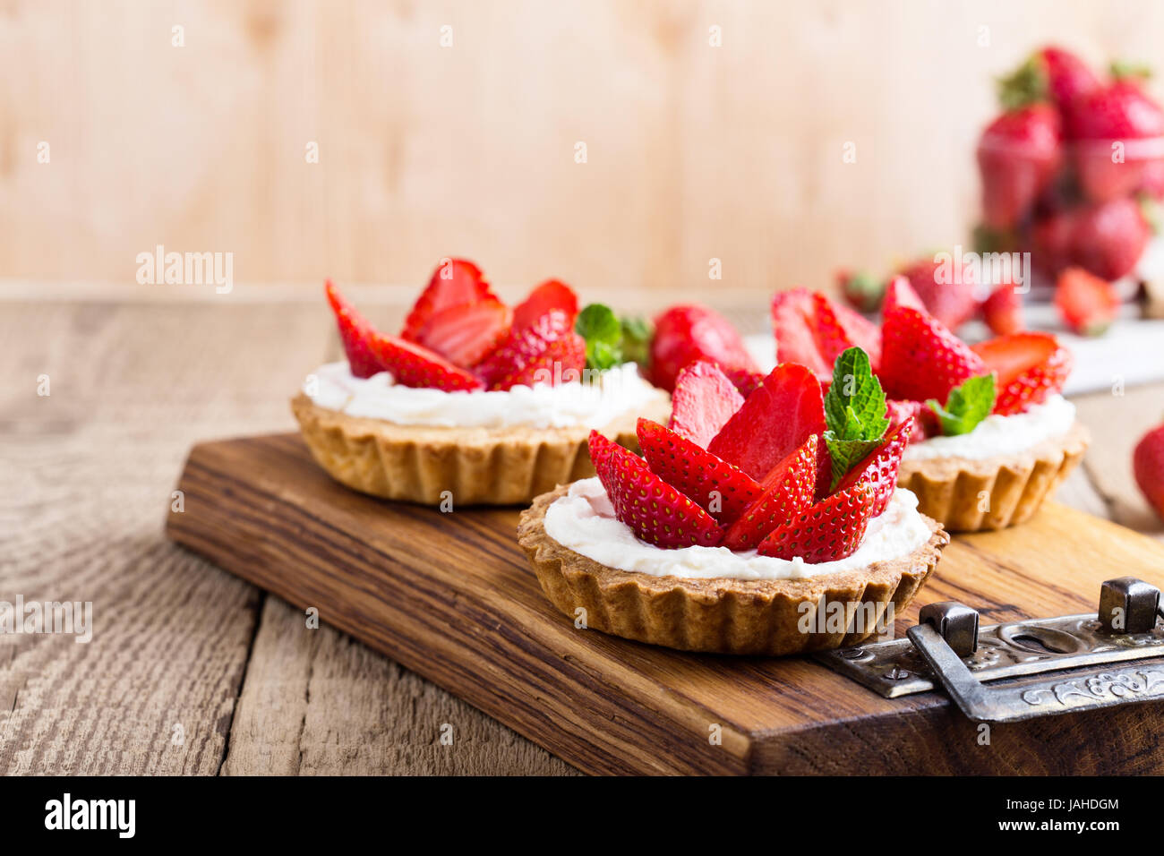 Strawberry shortcake pies on rustic wooden table, perfect party ...