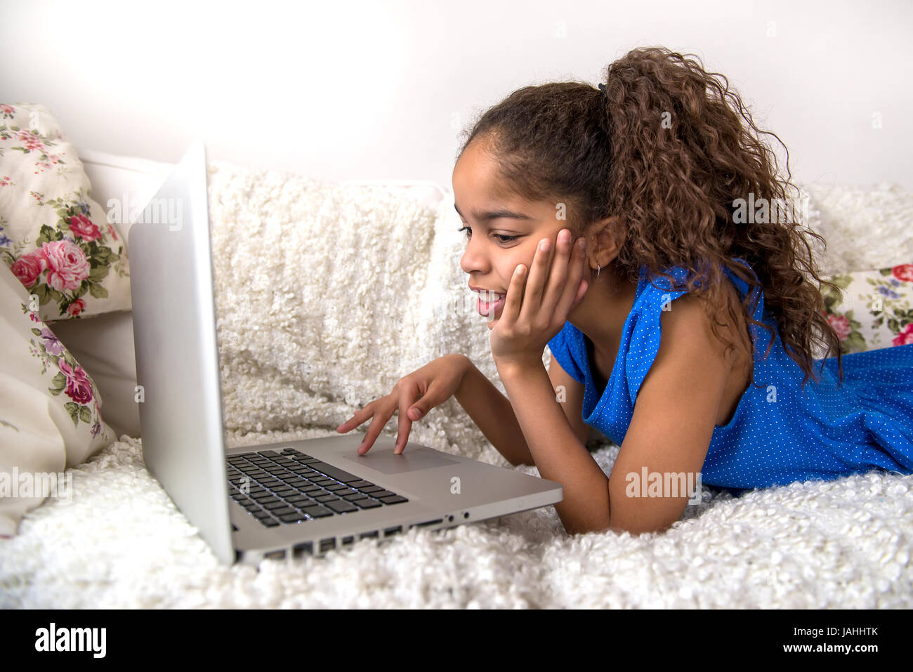 Teen girl laying on sofa hi-res stock photography and images - Alamy