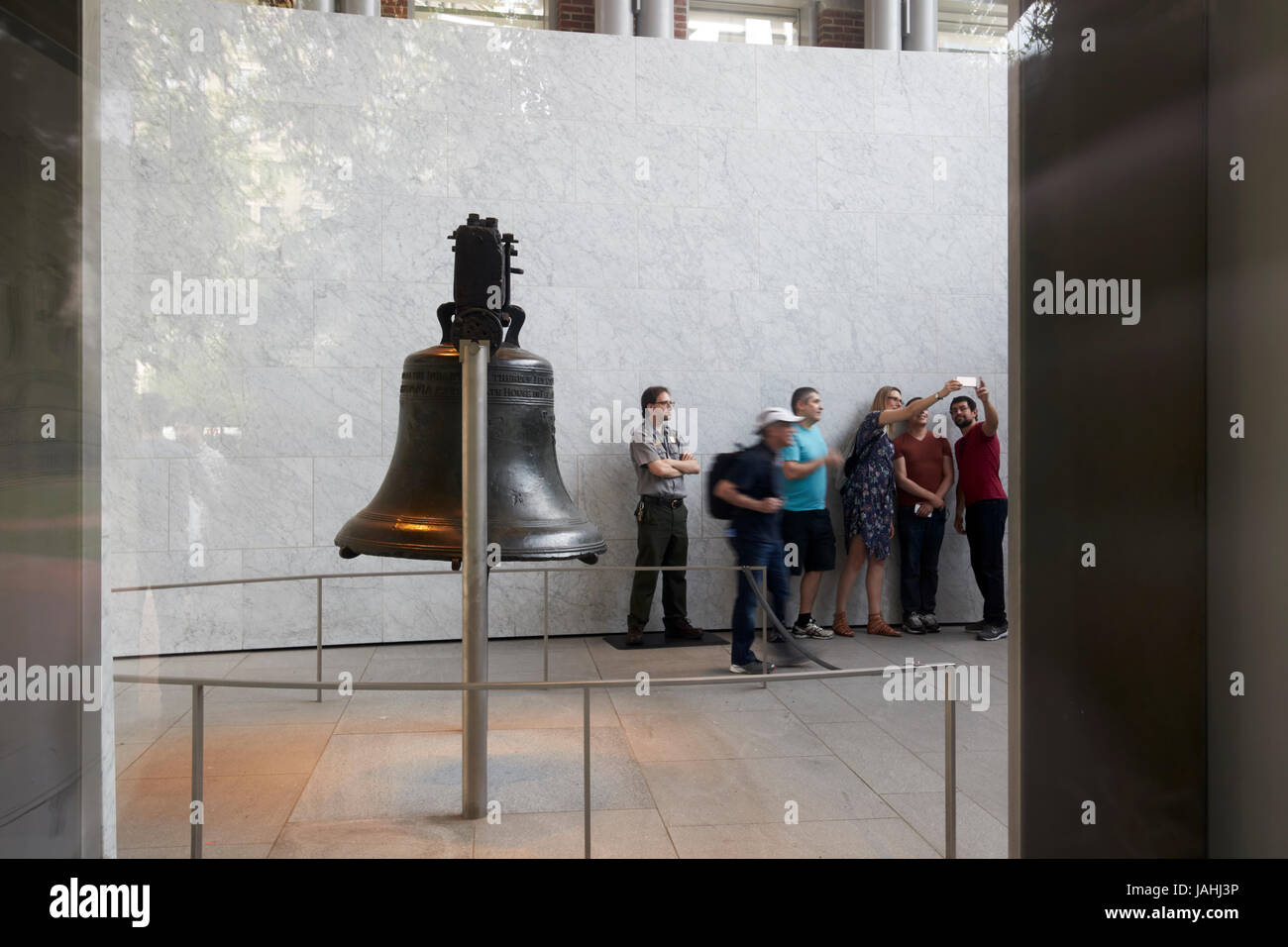 looking through the window at tourists queueing at the liberty bell Philadelphia USA Stock Photo