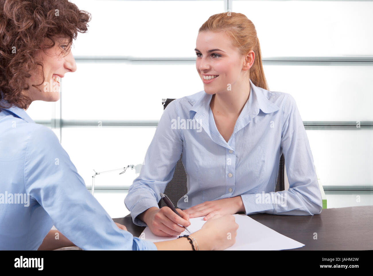 two business woman have a meeting in office Stock Photo - Alamy