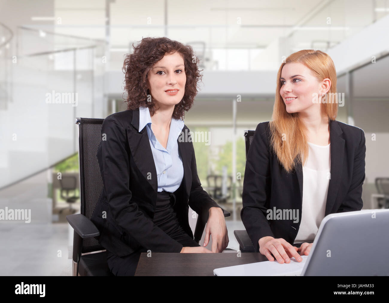 two business woman have a meeting in office Stock Photo - Alamy