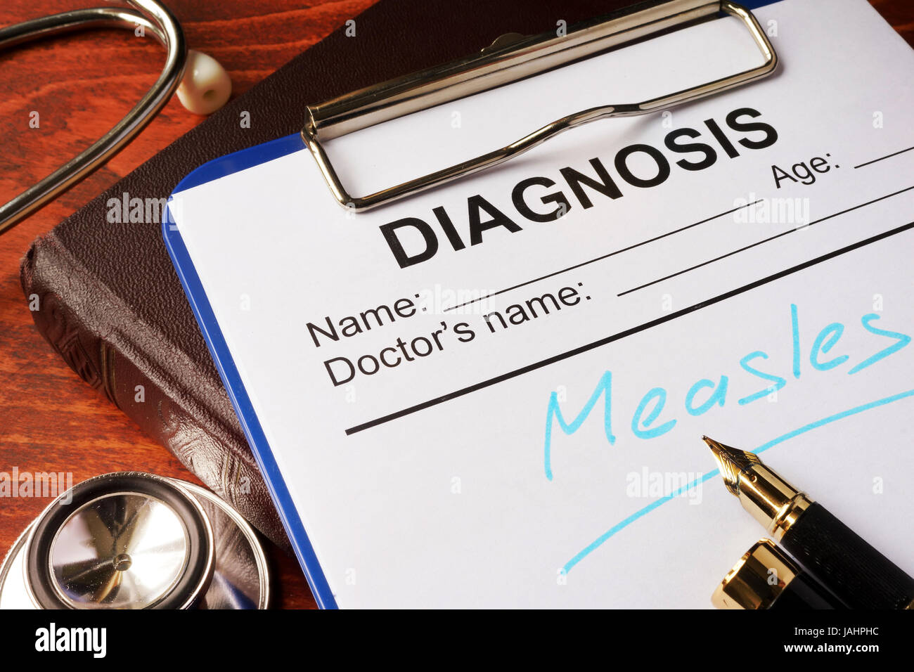 Medical form with diagnosis Measles on a table. Stock Photo