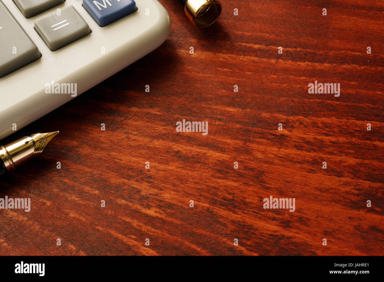 Calculator on a wooden table. Business background. Stock Photo