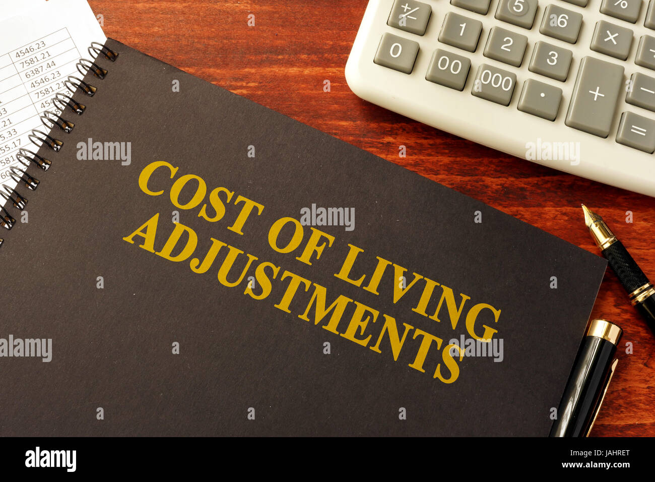 Book with title Cost of Living Adjustments (COLAs Stock Photo Alamy