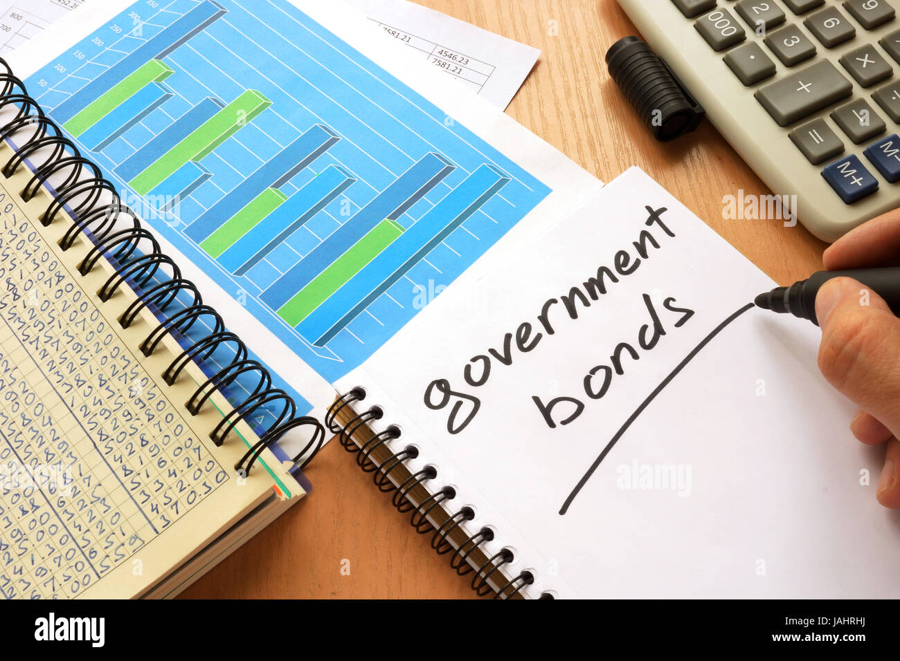 Government bonds written in a note. Trading concept. Stock Photo