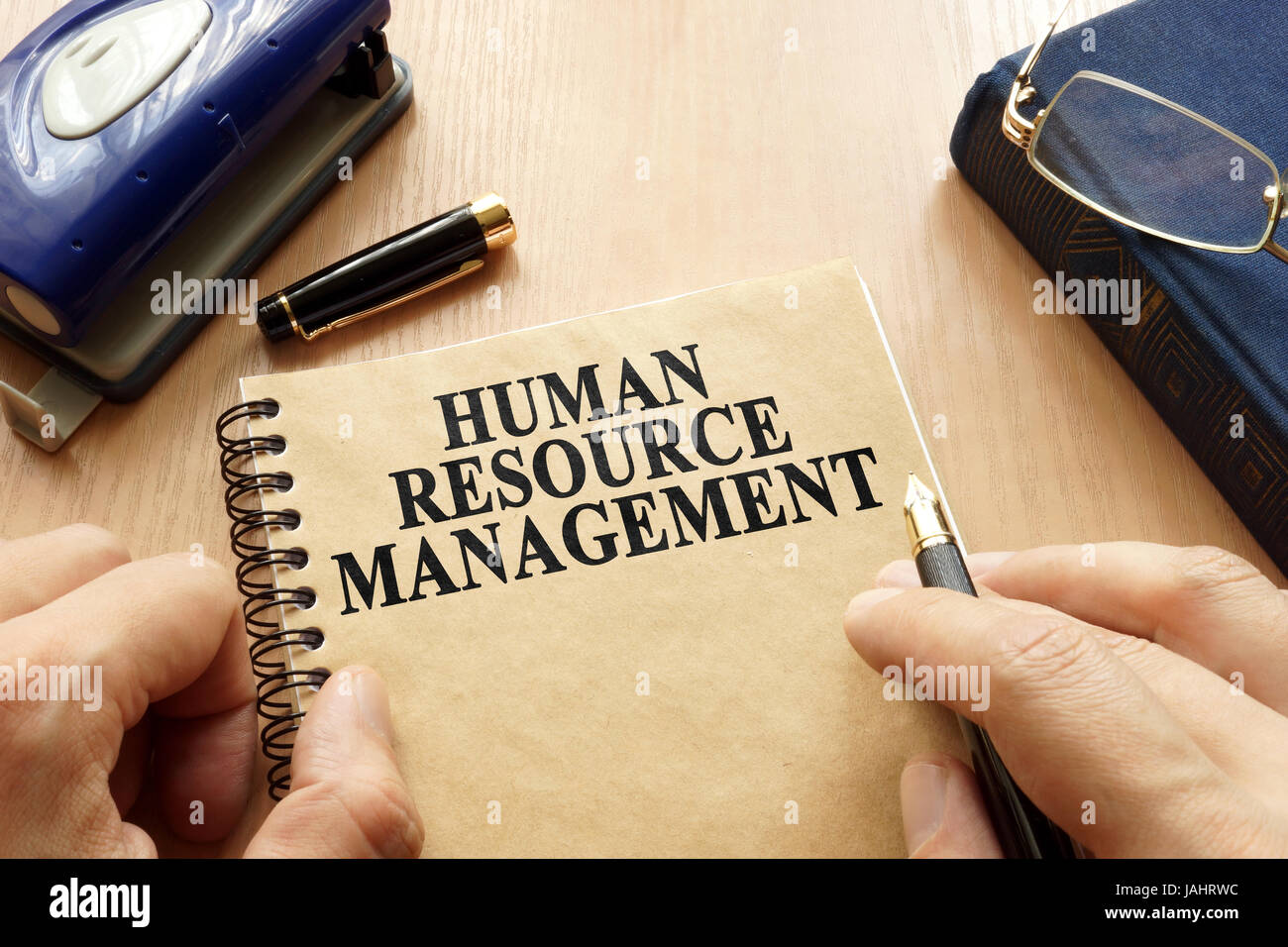 Book with title HRM - Human Resource Management. Stock Photo