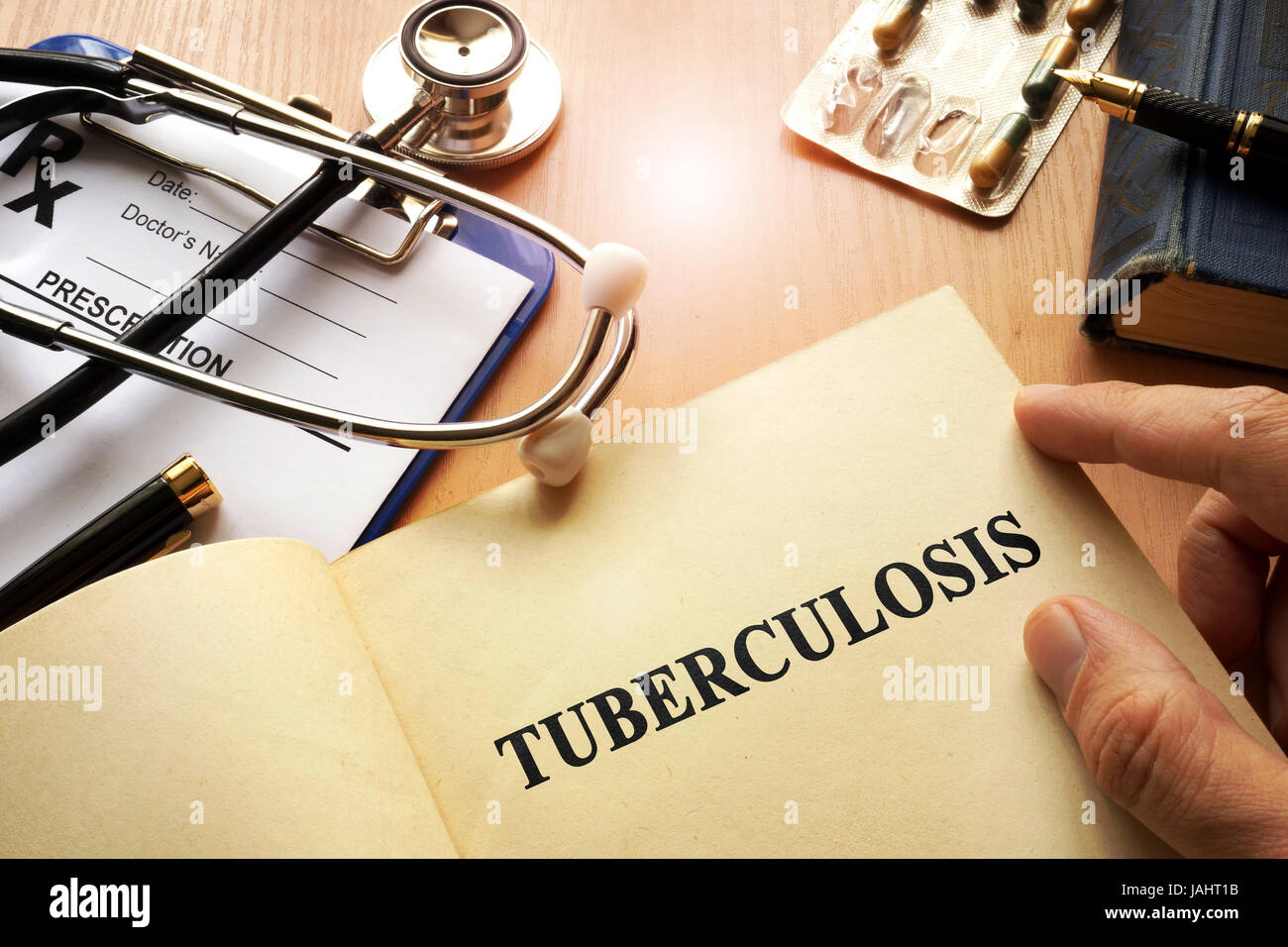 Book with title Tuberculosis on a table. Stock Photo