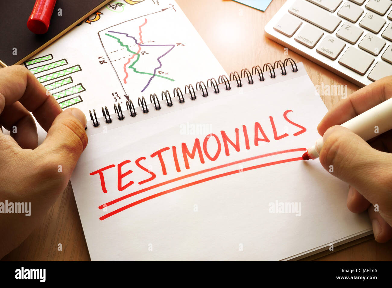 Testimonials written in a note. Client communication concept. Stock Photo