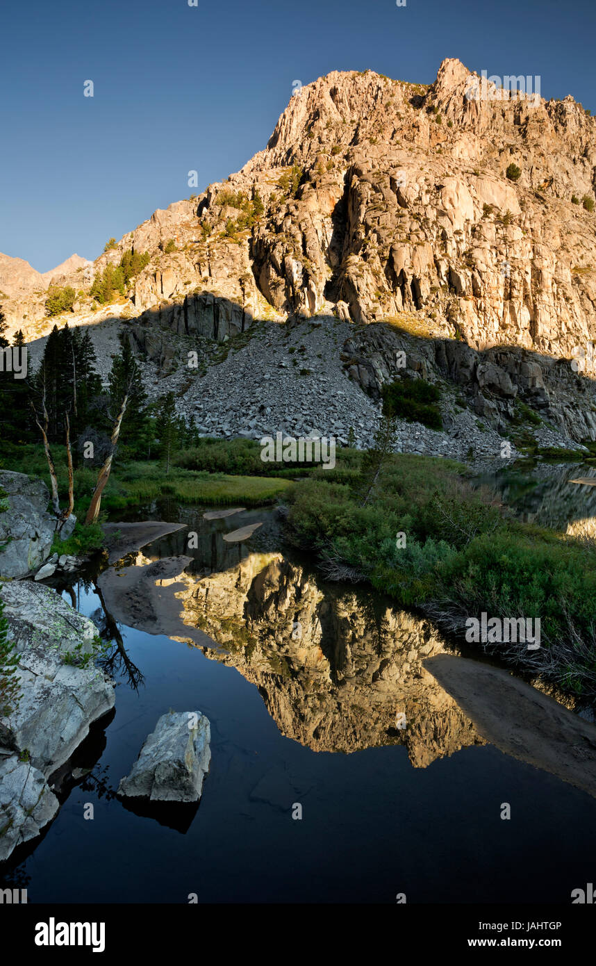 CA03277-00...CALIFORNIA - Early morning reflection in Willow Lake located in the South Fork Big Pine Creek Valley of the John Muir Wilderness. Stock Photo