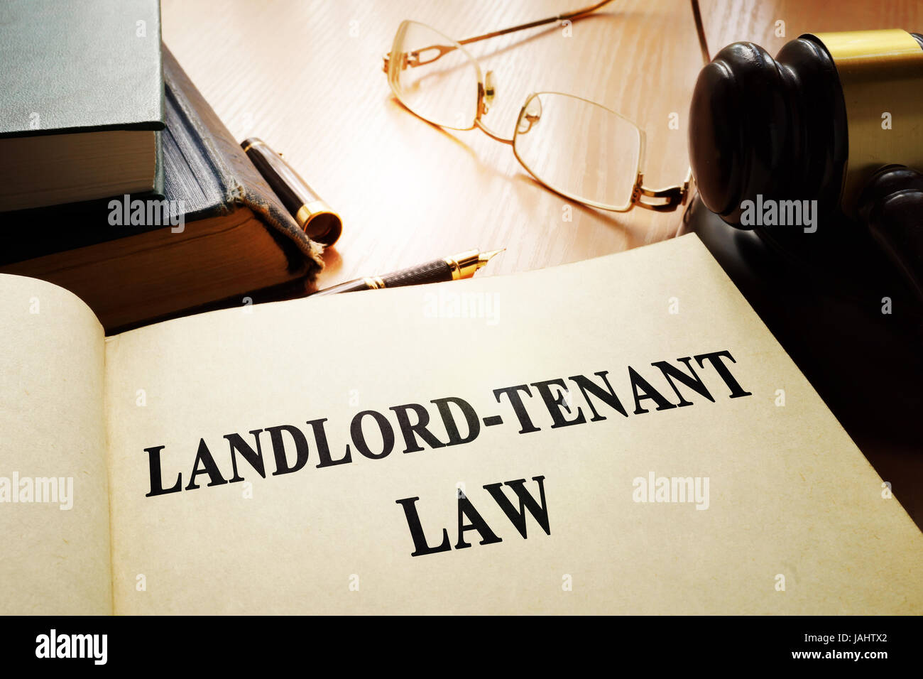 Landlord-tenant law on an office table. Stock Photo