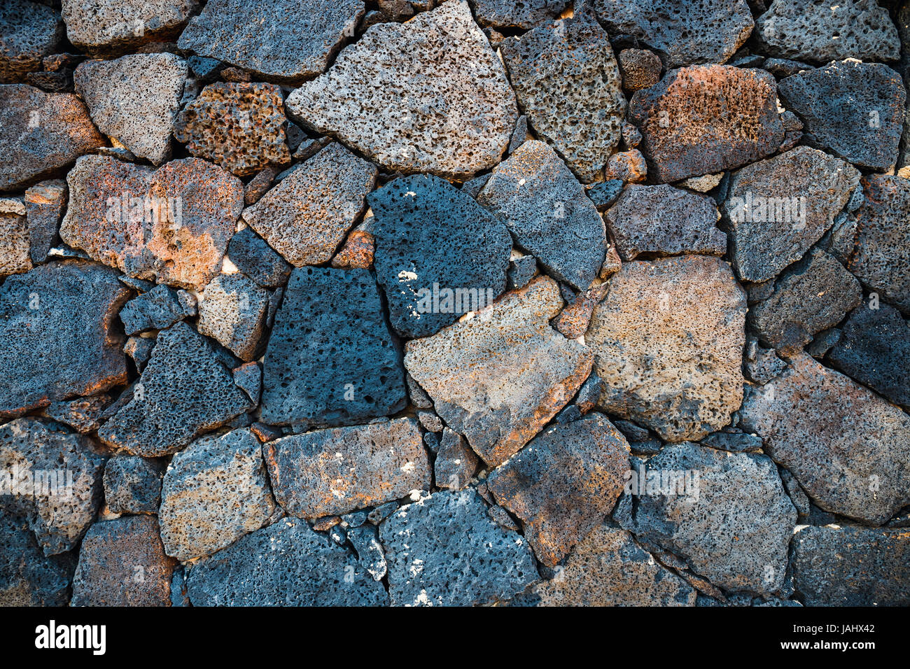 Basalt volcanic rock wall use as background Stock Photo - Alamy
