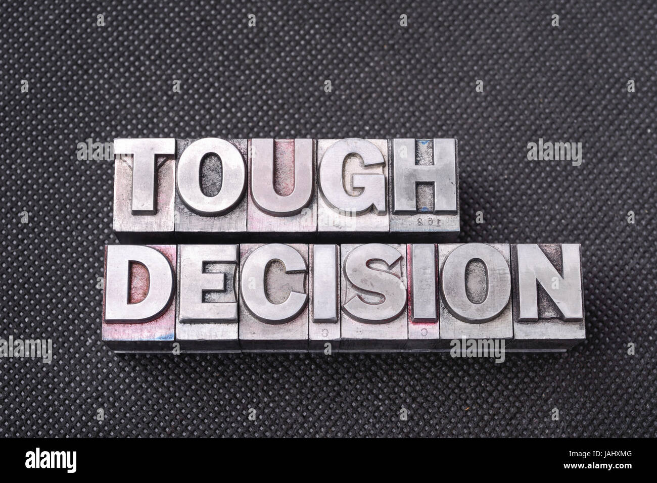 tough-decision-phrase-made-from-metallic-letterpress-blocks-on-black