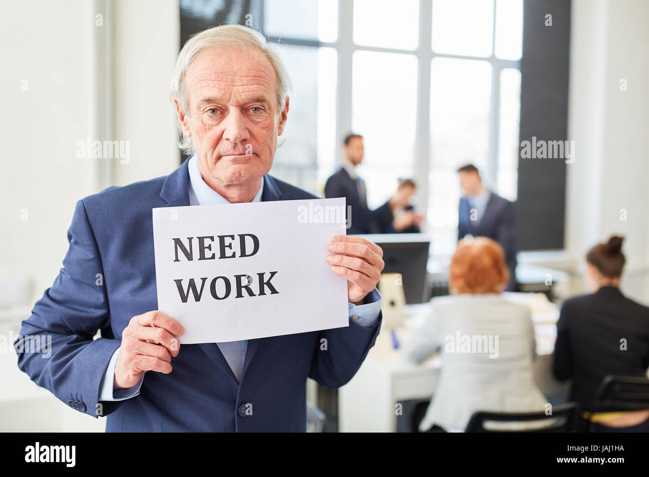 Unemployed senior as candidate looking for a job Stock Photo