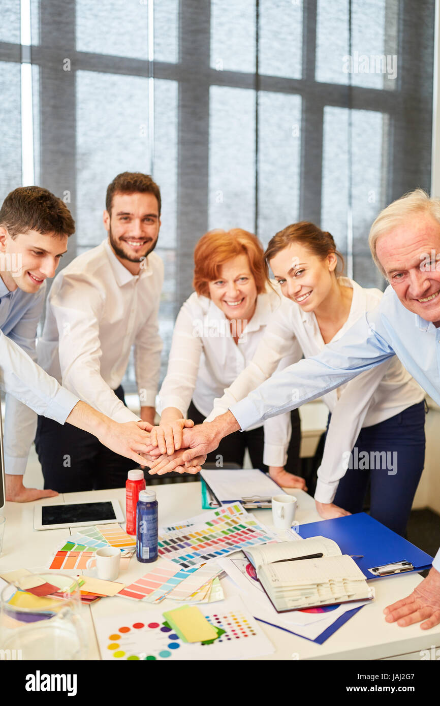 Designer Team Rocks Successful team of designers stack their hands together with joy Stock ...