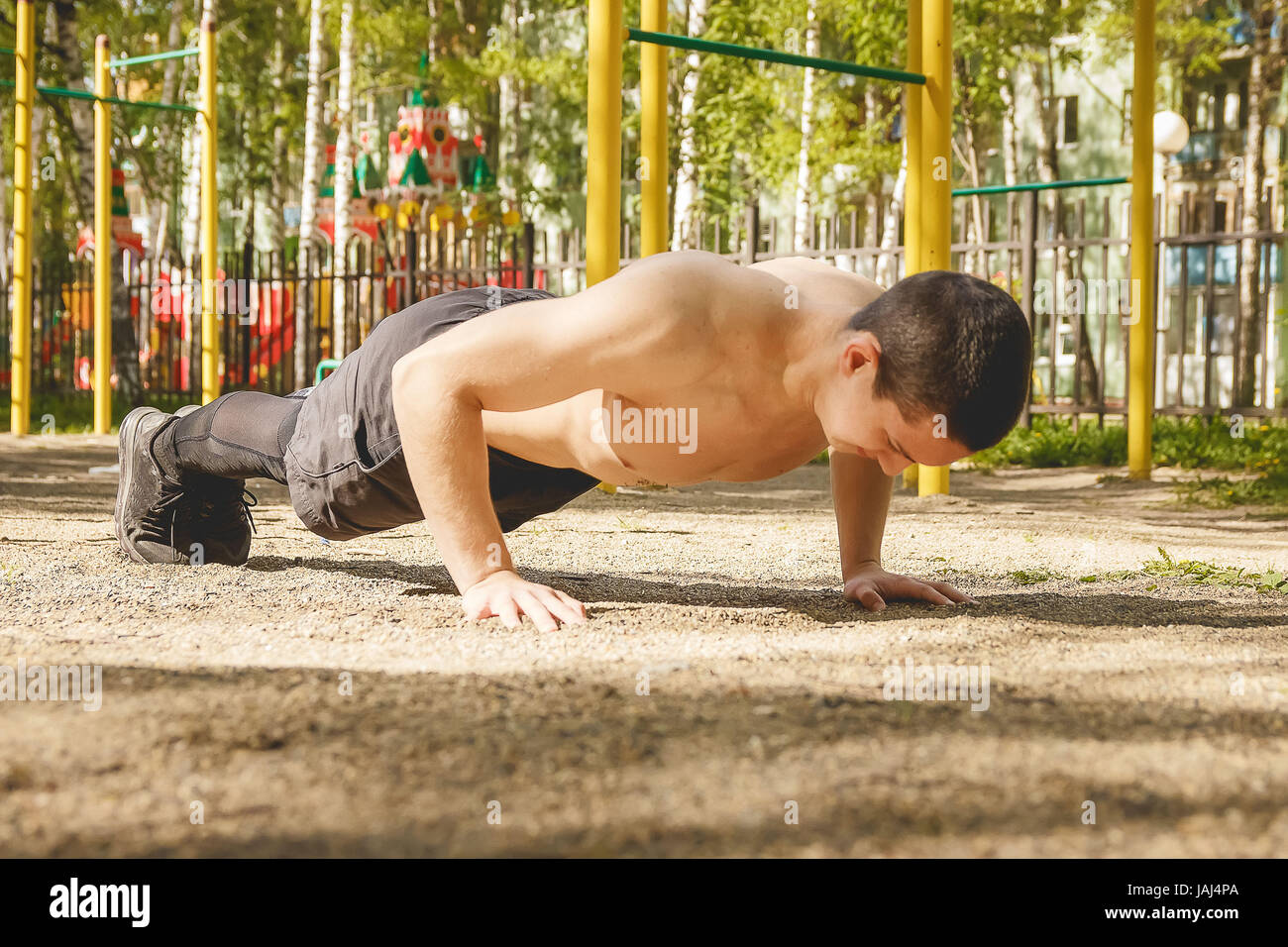 Young Athletic Man Exercising Outdoors Push-ups. Healthy lifestyle ...