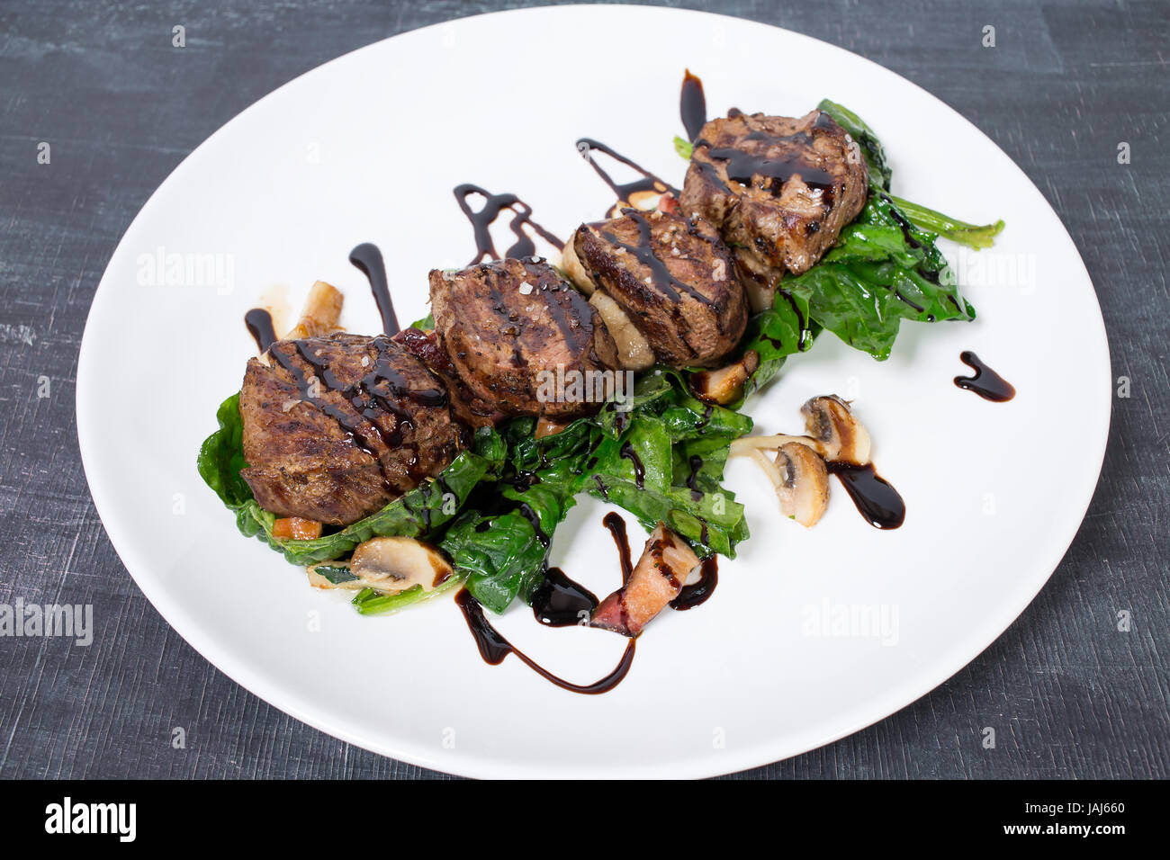 Delicious Chateaubriand Steak With Mushrooms And Spinach Plate Located delicious-chateaubriand-steak-with-mushrooms-and-spinach-plate-located