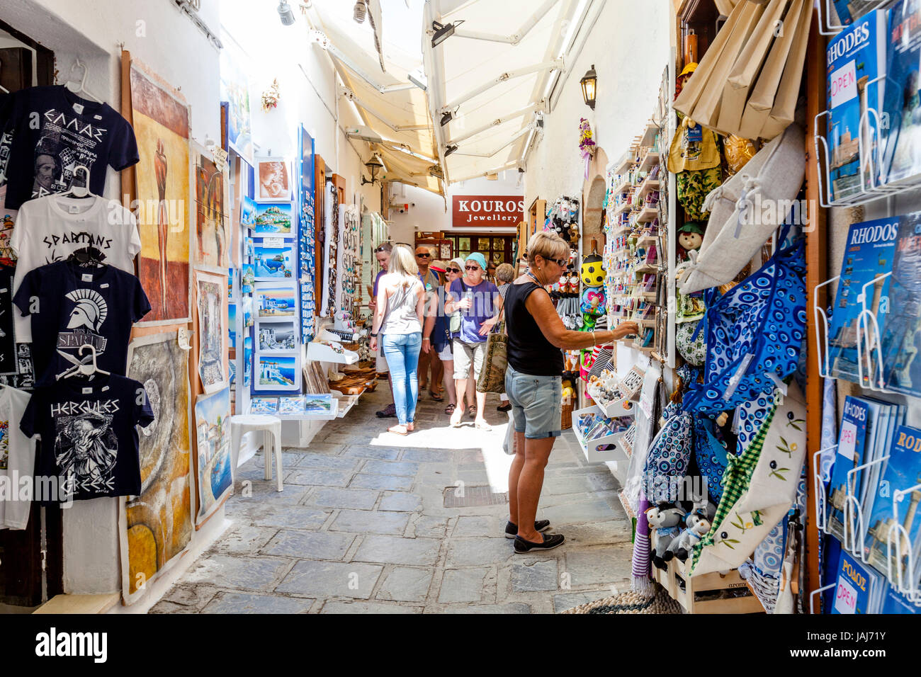 Tourists Shopping For Souvenirs In Lindos Village, Rhodes, Greece Stock