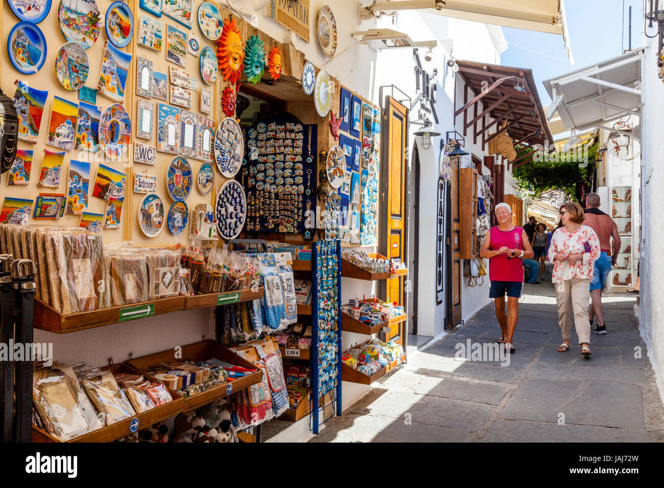 Tourists Shopping For Souvenirs In Lindos Town, Rhodes, Greece Stock