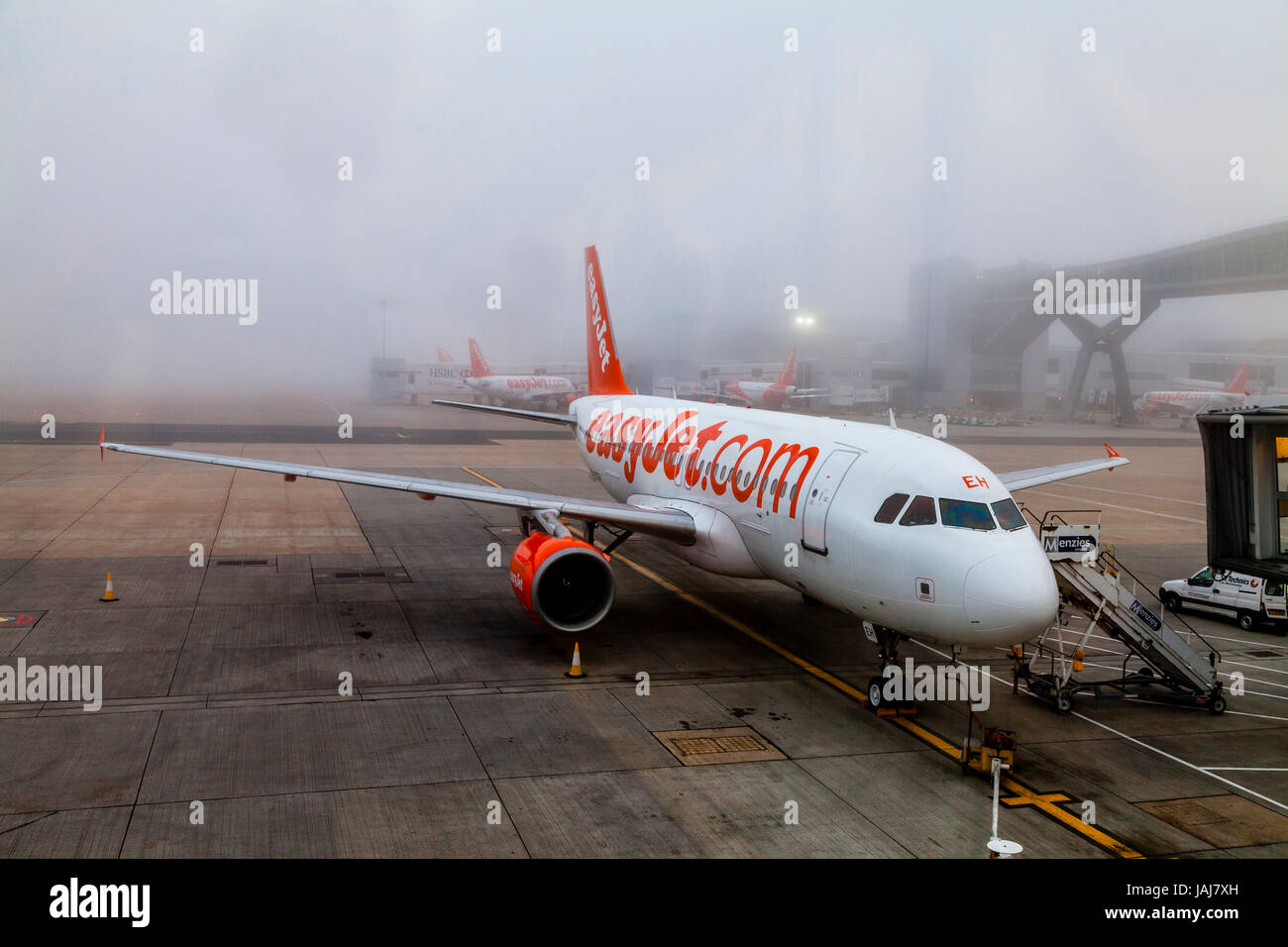 A Easy Jet Plane On The Ground In The Fog At London Gatwick Airport, West Sussex, UK Stock Photo