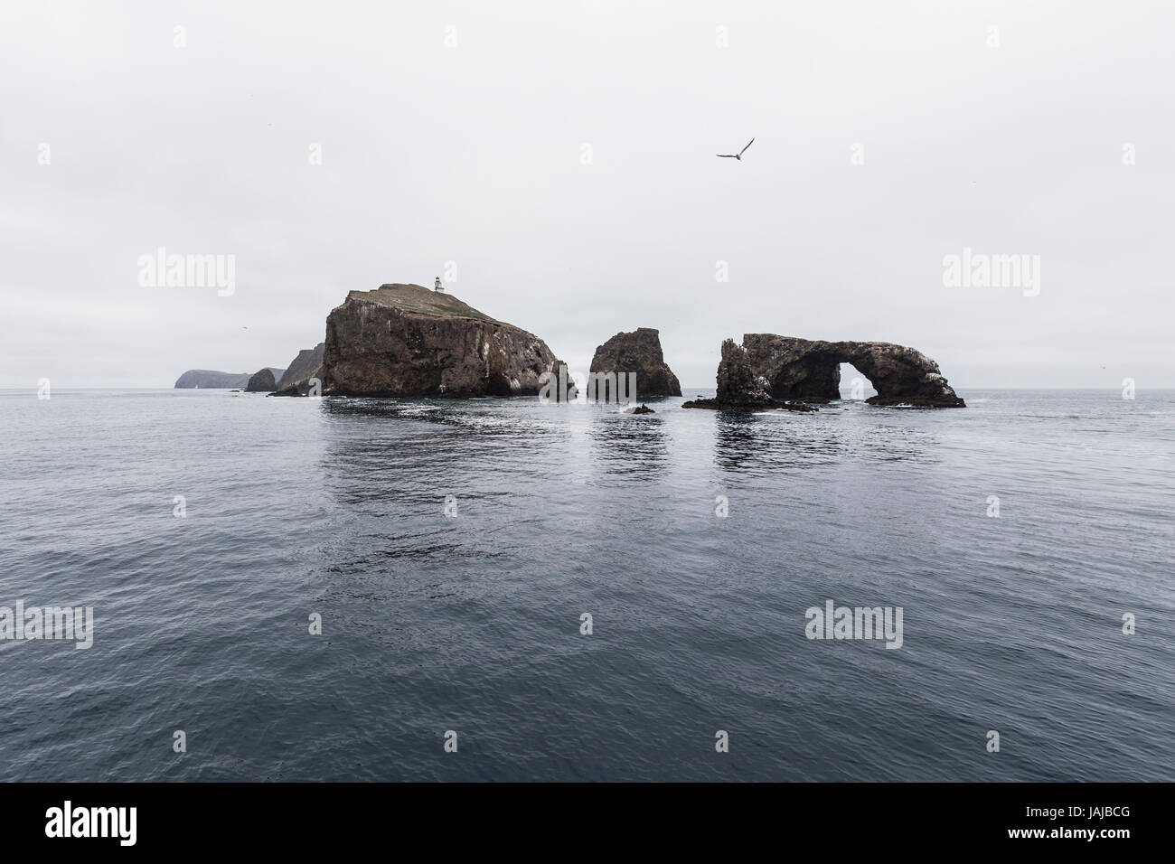 Anacapa Island with calm water and clouds at Channel Islands National Park in Southern California. Stock Photo