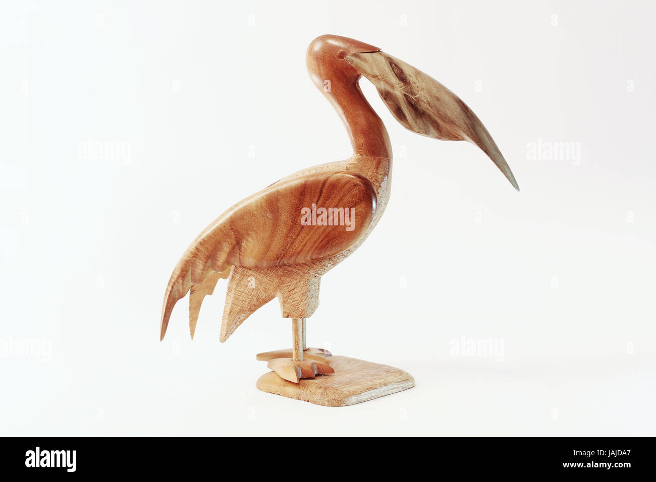 Pelican Wooden Sculpture isolated on white Stock Photo - Alamy
