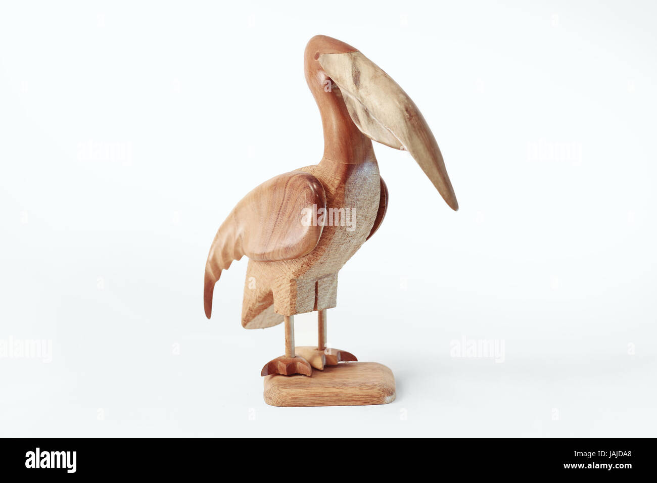 Pelican Wooden Sculpture isolated on white Stock Photo - Alamy