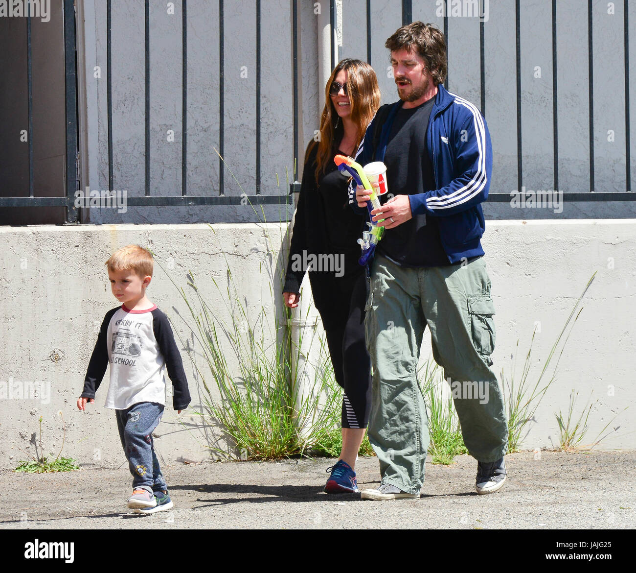 Christian Bale out for breakfast with his wife Sibi Blazic and their son  Joseph. Christian holding a couple of snorkels in his hand. Featuring:  Christian Bale, Sibi Blazic, Joseph Bale Where: Brentwood,