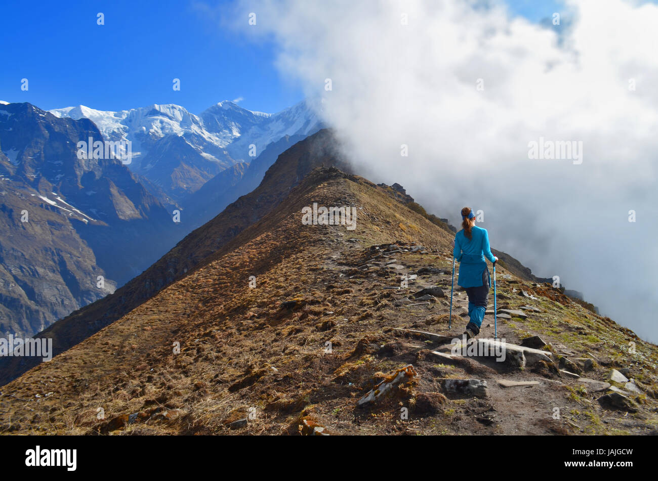 Traveler (woman) in Nepal, Annapurna region, Mardi Himal track. Stock Photo