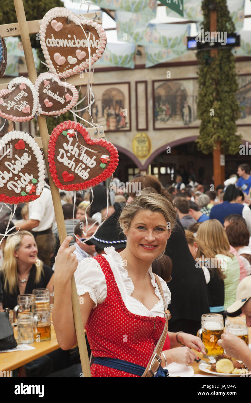 Germany,Bavaria,Munich,October feast,woman,gingerbread hearts sell, Stock Photo