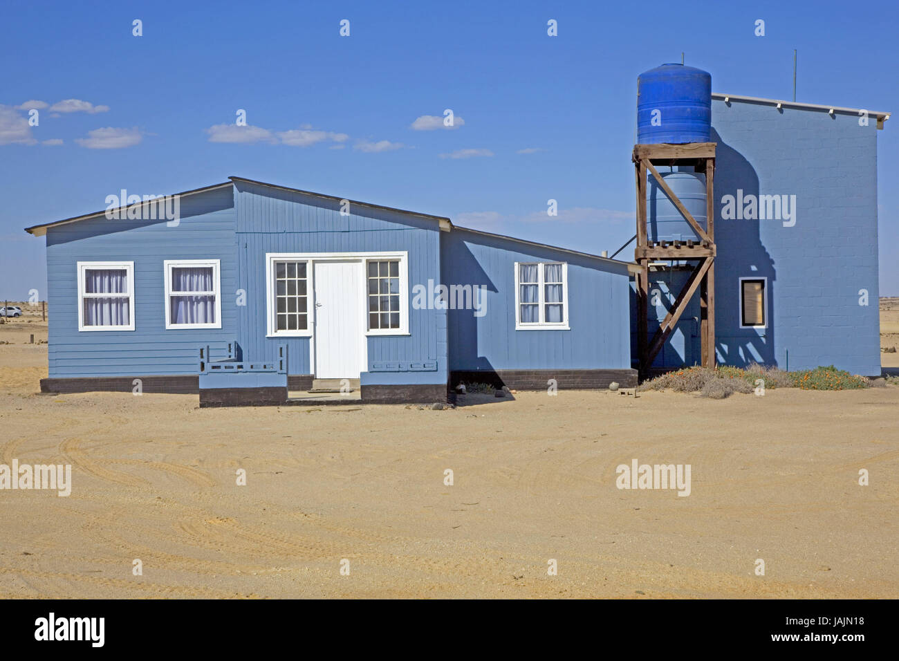 Africa,South-West Africa,Namibia,Erongo  region,Wlotzkasbaken,coast,settlement,houses,buildings,summer  cottages,houses,blue,rich in fantasia,worth seeing,interesting,sandy  beach,Sand,sky,blue,South-West Africa,Wlotzkasbaken Stock Photo - Alamy